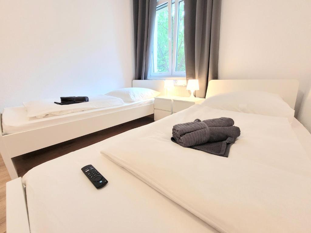 Postel nebo postele na pokoji v ubytování Voll ausgestattete Ferienwohnung in Dresden