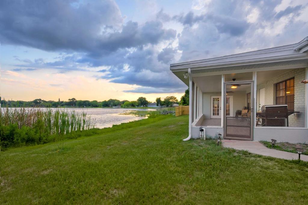 a house with a view of a river at Lovely Lakefront Home with Grill 7 Mi to Legoland! in Winter Haven