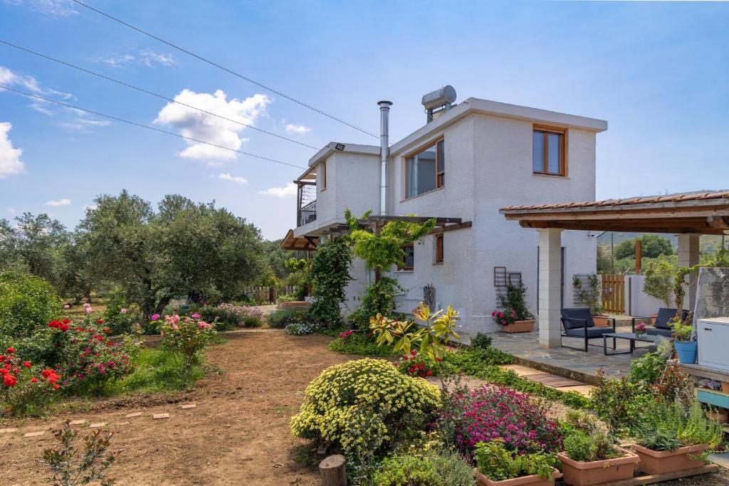 a house with a garden in front of it at Eliva house in Chania Town