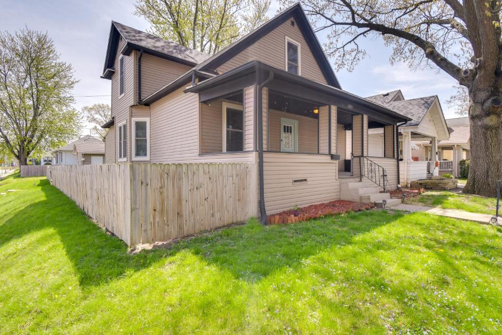 a house with a fence in the yard at Pet-Friendly Davenport Home - Near Casino and Golf in Davenport