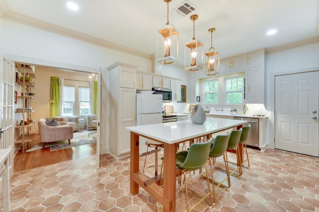 a kitchen with a table and chairs in a room at Charming Lake Charles Vacation Rental with Yard in Lake Charles