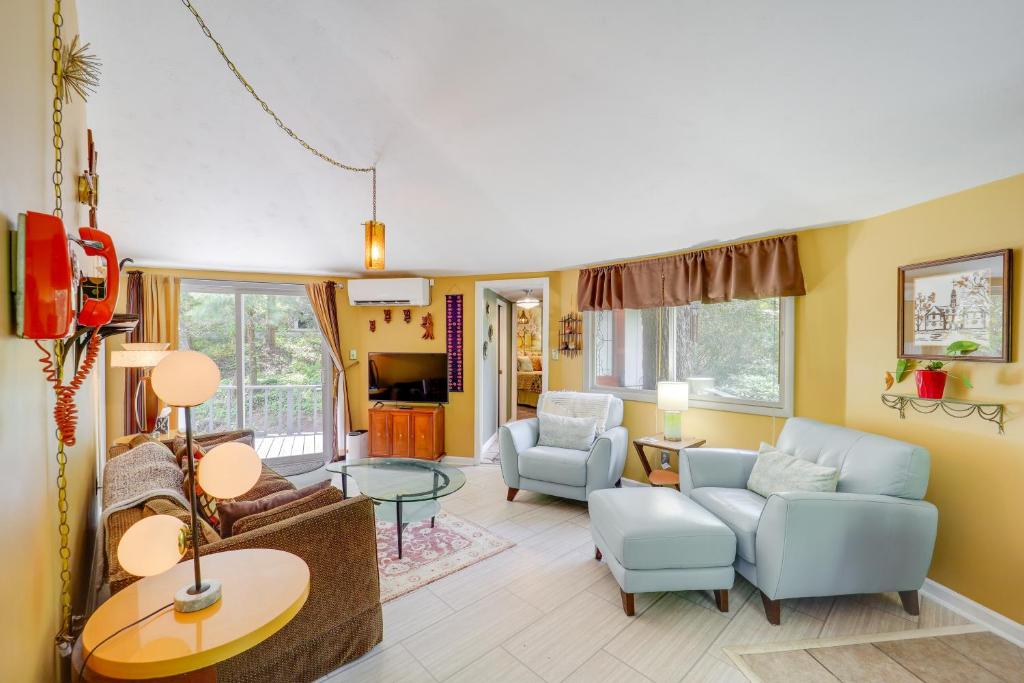 a living room with a couch and chairs and a table at Quaint Vacation Rental with Porch in Banner Elk! in Banner Elk