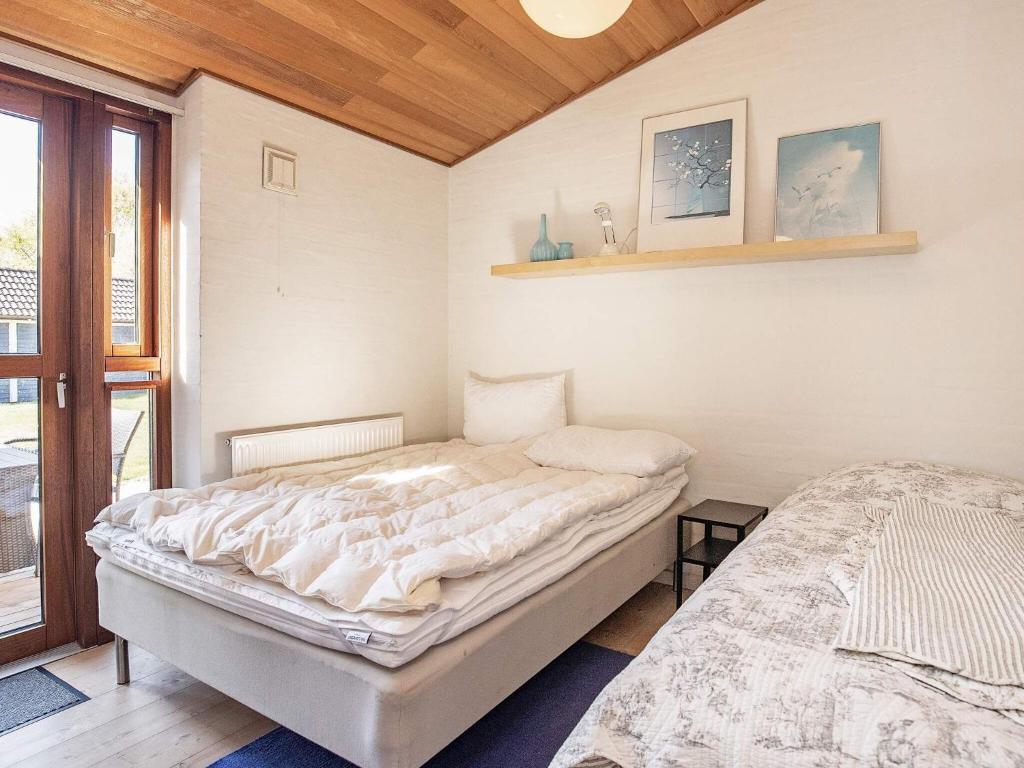 Postel nebo postele na pokoji v ubytování 8 person holiday home in Skagen-By Traum