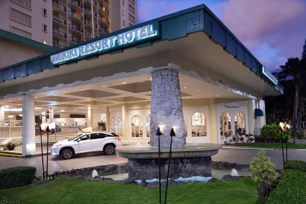 a car parked in front of a building at Waikiki Resort Hotel in Honolulu