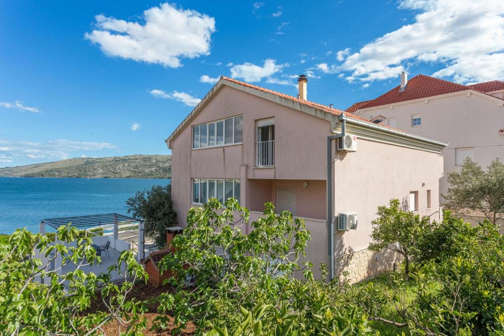 a house with a view of the water at Apartments by the sea Poljica, Trogir - 10353 in Marina