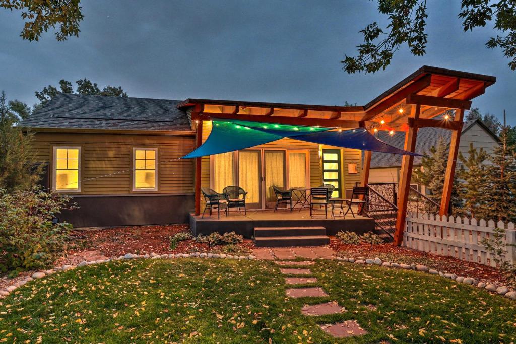 a house with a pergola in the yard at Fort Collins Vacation Rental with Private Hot Tub! in Fort Collins