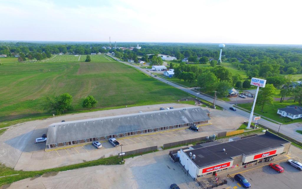 an overhead view of a building with a parking lot at Night Inn in Sweet Springs