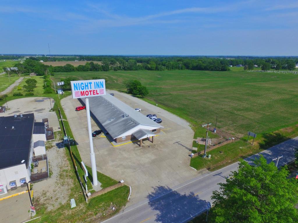 an aerial view of aventimirus herpes sign in a parking lot at Night Inn in Sweet Springs