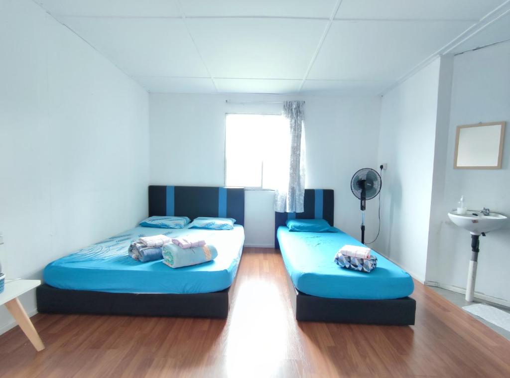 Postel nebo postele na pokoji v ubytování D' Limbai Cottage