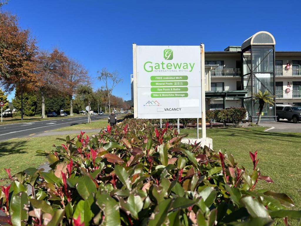 a sign for a gardeneway in front of a building at Gateway International Motel in Rotorua