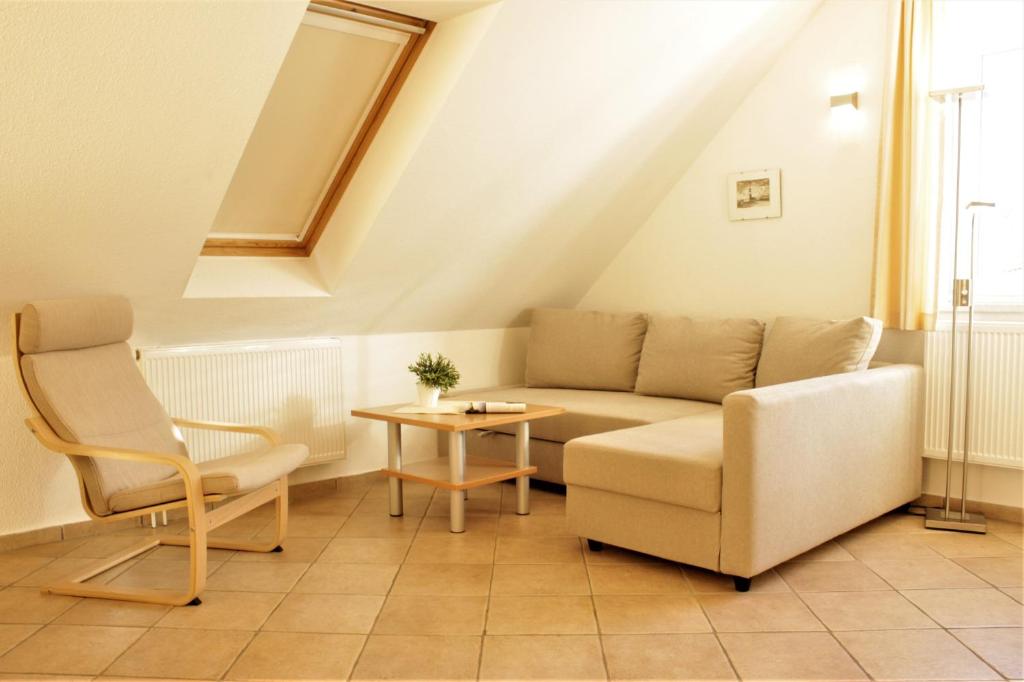 a living room with a couch and a table at Roter Erik App 4, DG re in Kirchdorf