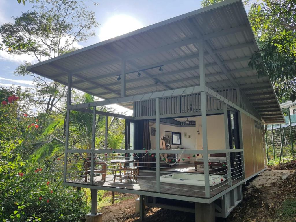 a rendering of a house with a roof at Nangu lodge in Sámara