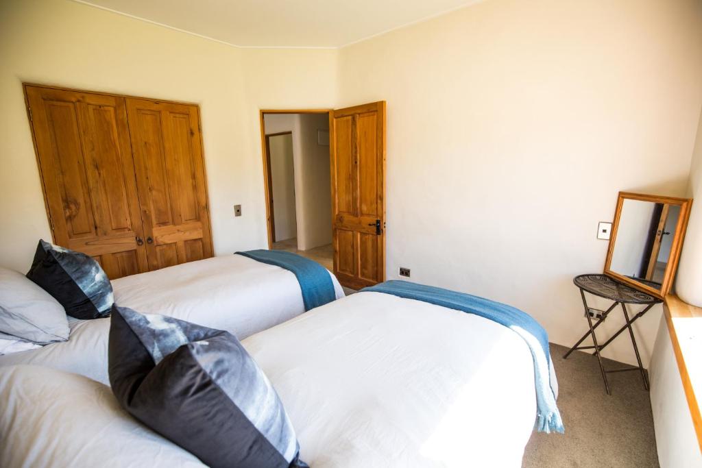 Postel nebo postele na pokoji v ubytování The River House Wanaka