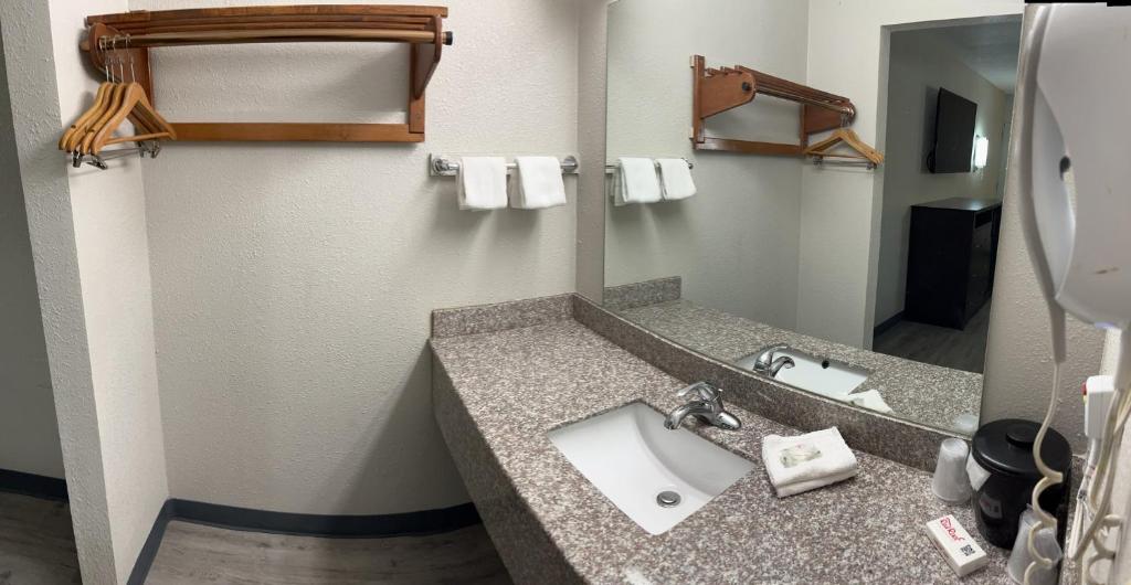 a bathroom with a sink and a mirror at Red Roof Inn Kimball, TN I-24 in Kimball