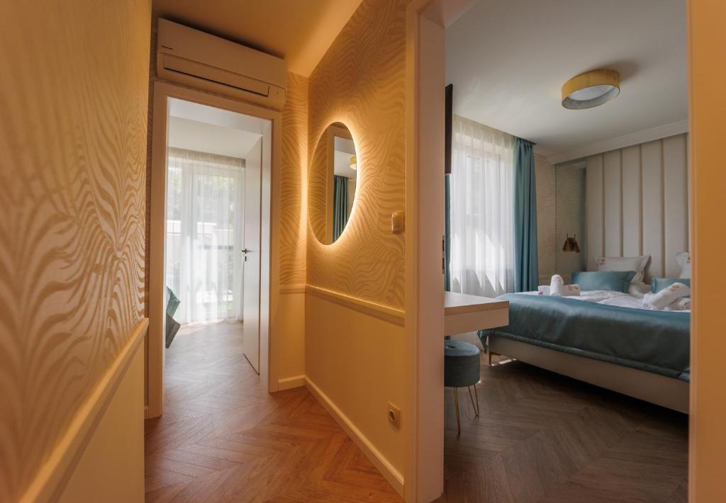 Postel nebo postele na pokoji v ubytování Gold Wave Apartments
