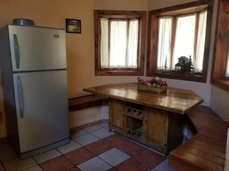 Kuchyň nebo kuchyňský kout v ubytování Cabaña rustica a 1km de cascada
