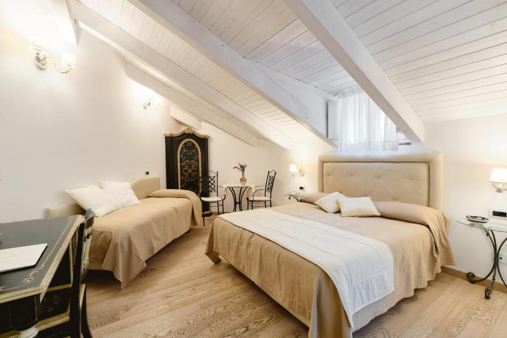 Letto o letti in una camera di Villa Fabiana