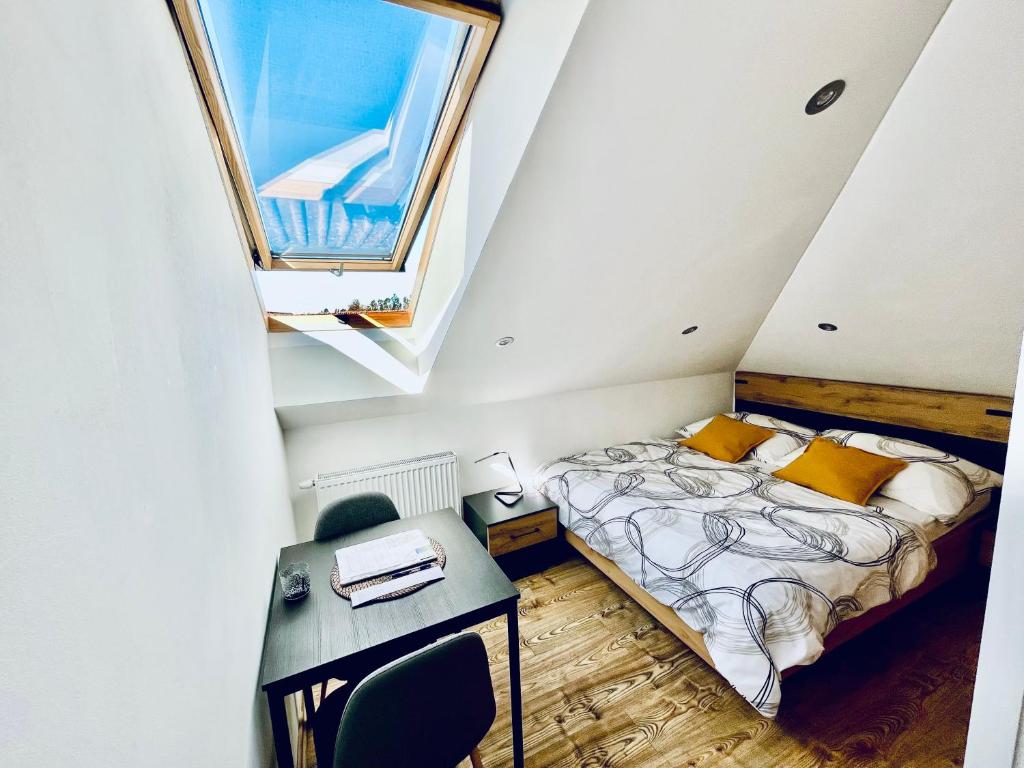 Postel nebo postele na pokoji v ubytování Apartmány v ráji (Českém)