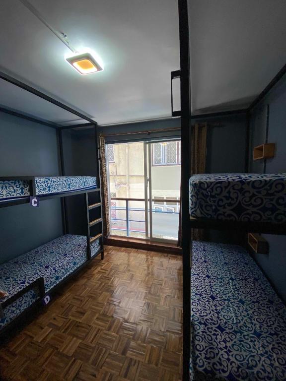 Postel nebo postele na pokoji v ubytování Alobar1000 Hostel