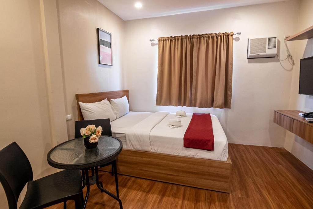 Postel nebo postele na pokoji v ubytování Kiwi Hotel