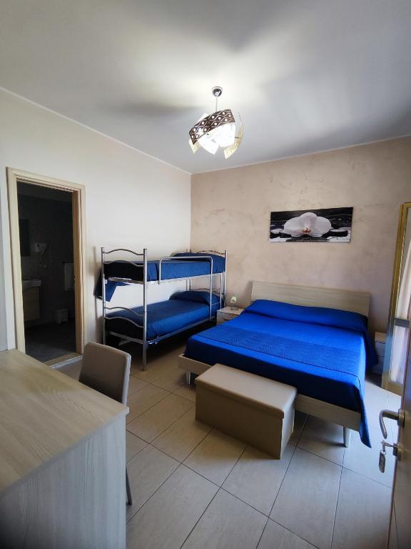 Postel nebo postele na pokoji v ubytování Albergo Primavera