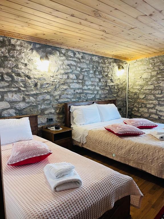 Postel nebo postele na pokoji v ubytování Medieval Rooms