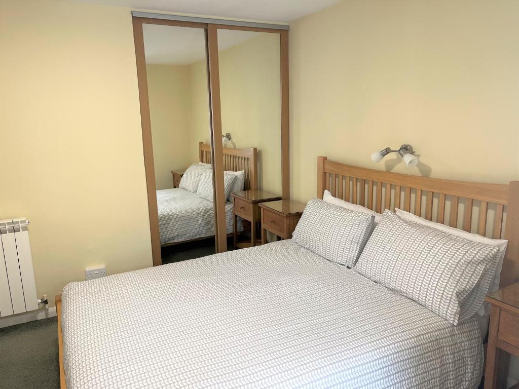 Postel nebo postele na pokoji v ubytování Ilex Lodge