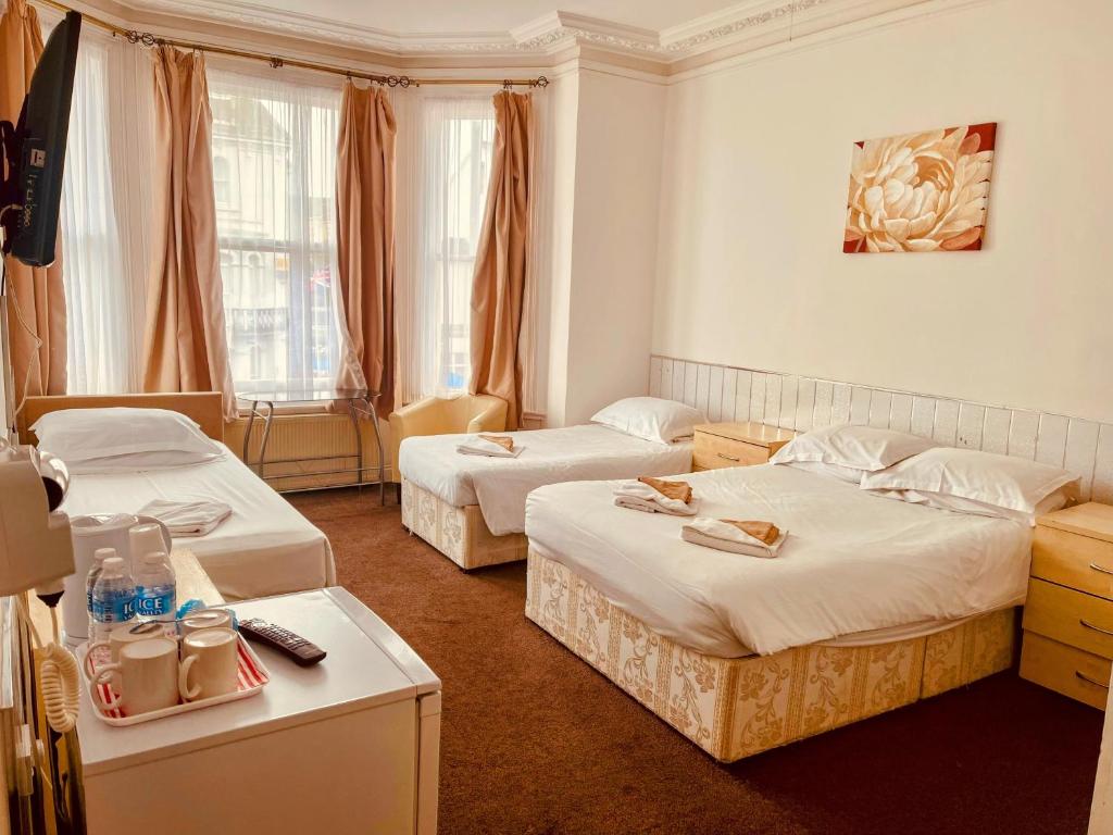 Postel nebo postele na pokoji v ubytování St George Hotel Great Yarmouth
