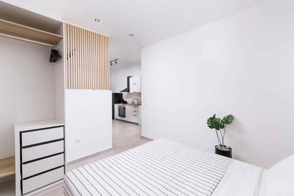 Postel nebo postele na pokoji v ubytování Euphoria Luxury Apartment