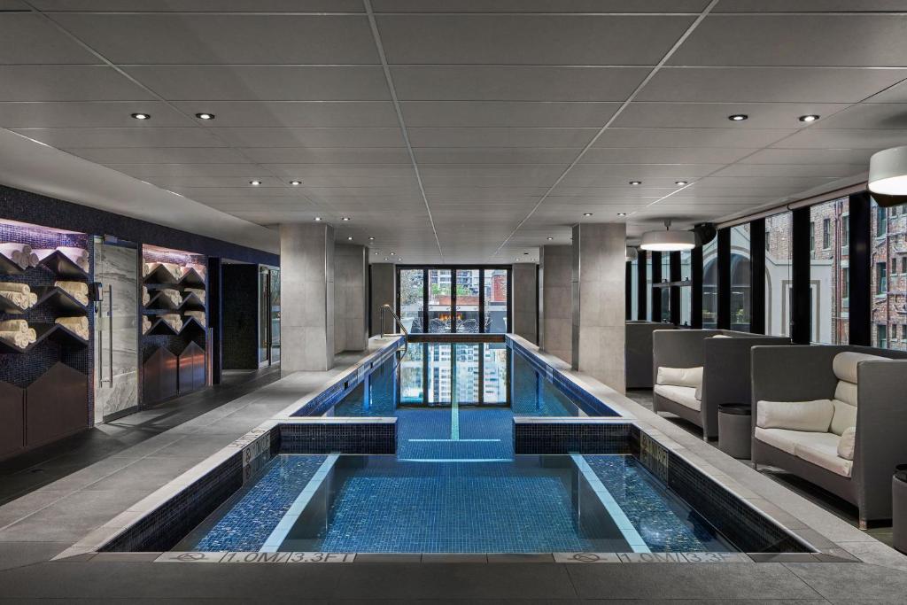 a swimming pool in the middle of a building at Sheraton Melbourne Hotel in Melbourne