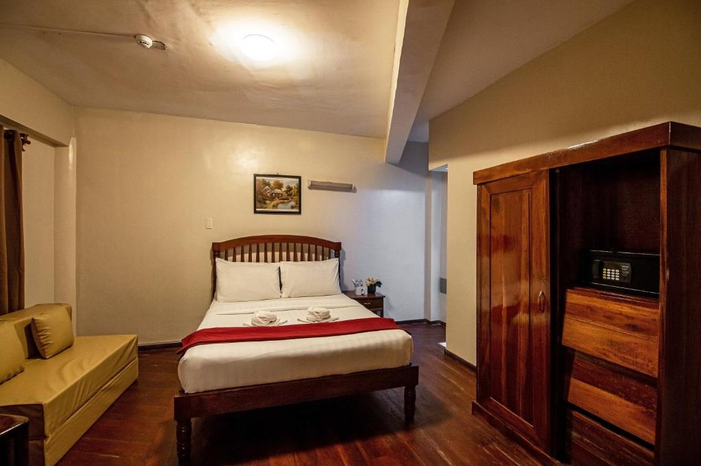 Postel nebo postele na pokoji v ubytování Kiwi Hotel