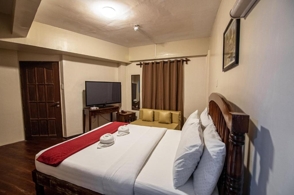 Postel nebo postele na pokoji v ubytování Kiwi Hotel