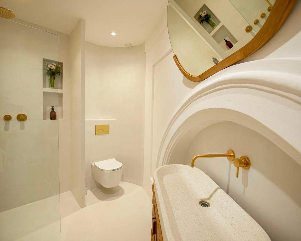 a bathroom with a sink and a toilet at Kaple svaté Markéty in Žďár nad Sázavou