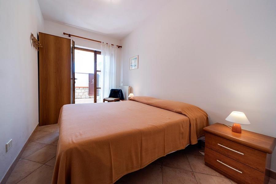 Postel nebo postele na pokoji v ubytování Villa Cecilia - Appartamenti