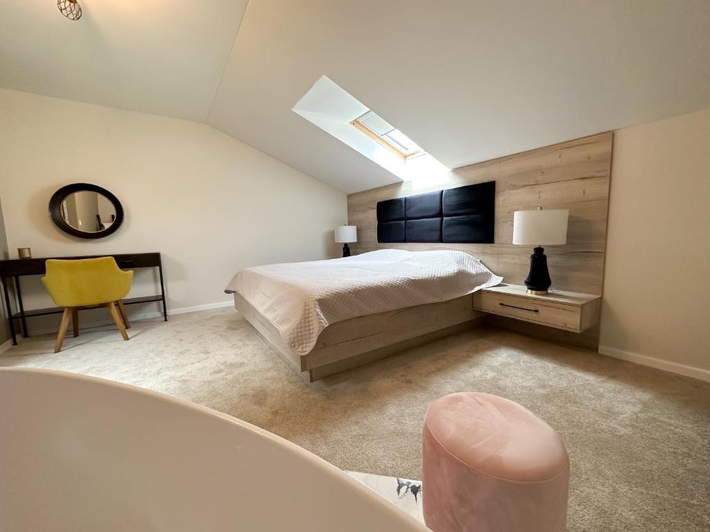 Postel nebo postele na pokoji v ubytování MILIA wine & event resort