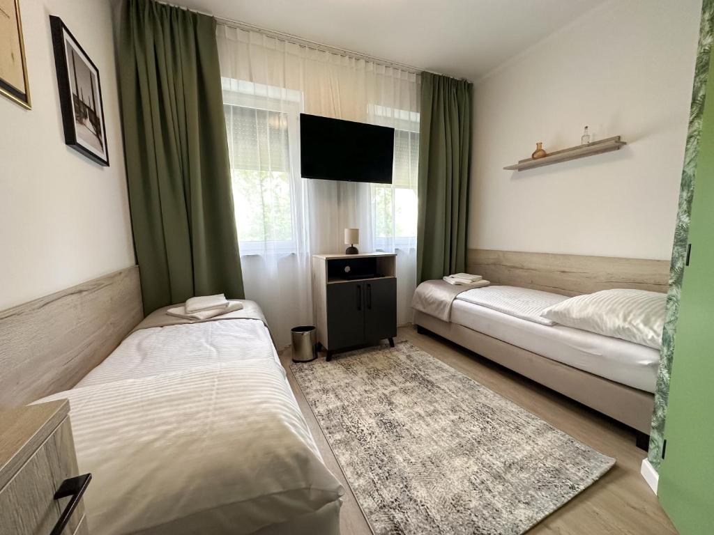 Postel nebo postele na pokoji v ubytování MILIA wine & event resort