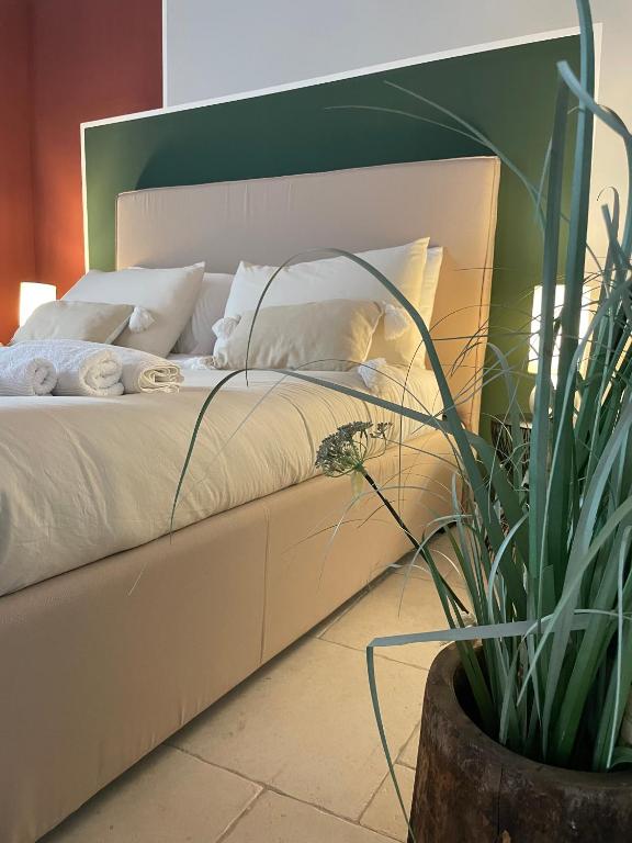 Łóżko lub łóżka w pokoju w obiekcie B&B Torre Sibissi Bari