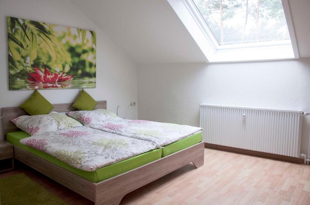 Postel nebo postele na pokoji v ubytování Ferienwohnung Sperlingslust