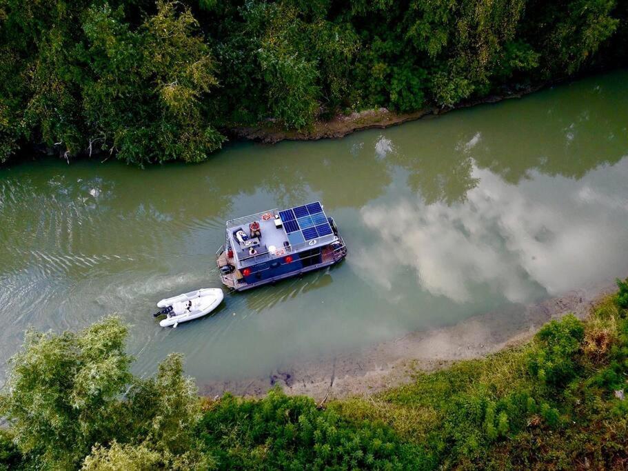 an aerial view of a boat in a river at Danube Delta Houseboat in Tulcea