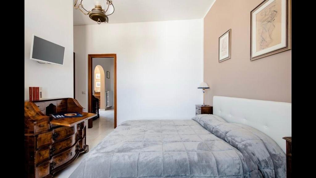Postel nebo postele na pokoji v ubytování B&B Maison Rosetta IUN-E4948