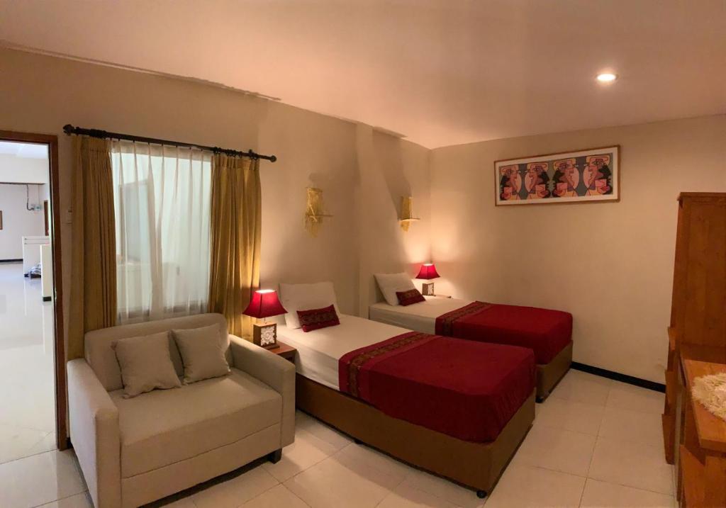 Kuta Suci Guesthouse - Deluxe Twin Room