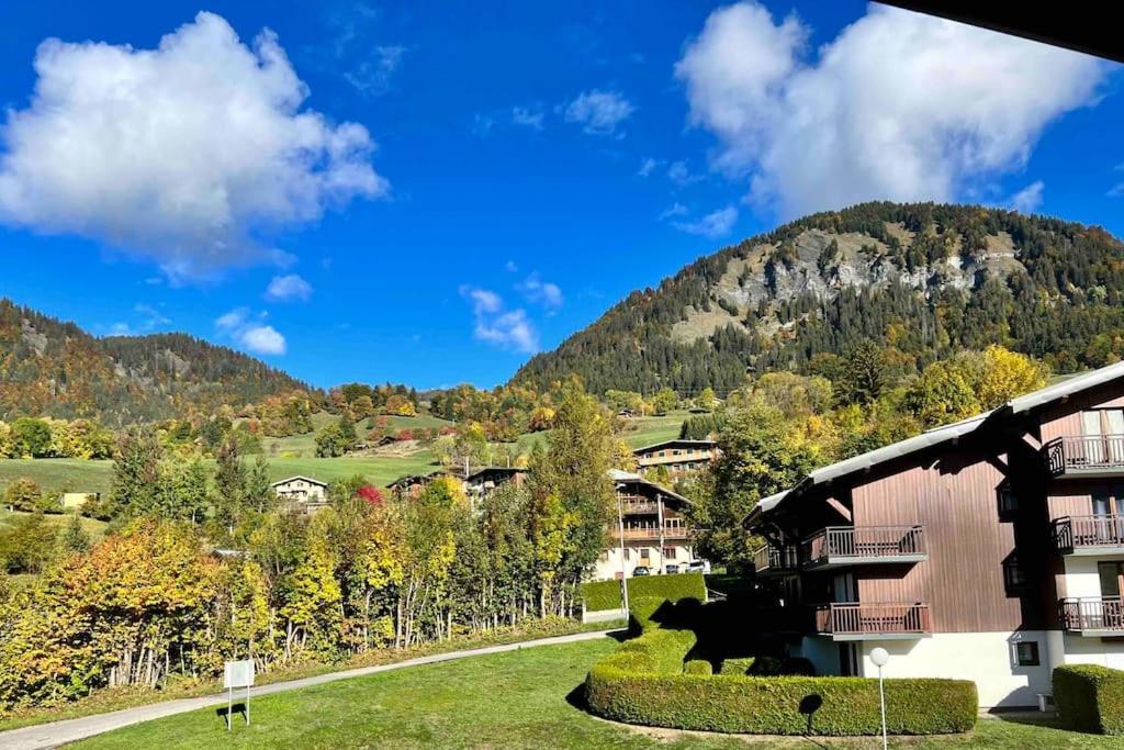 a resort with a mountain in the background at Studio à Praz-sur-Arly in Praz-sur-Arly