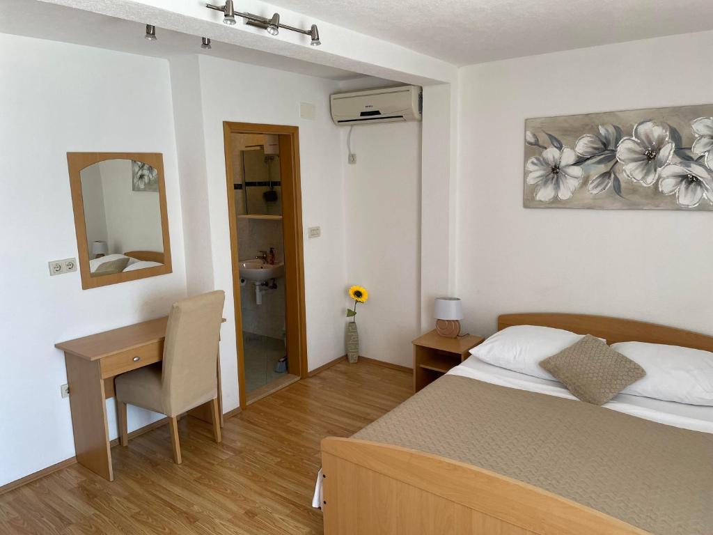 Posteľ alebo postele v izbe v ubytovaní Apartment Room Parčina