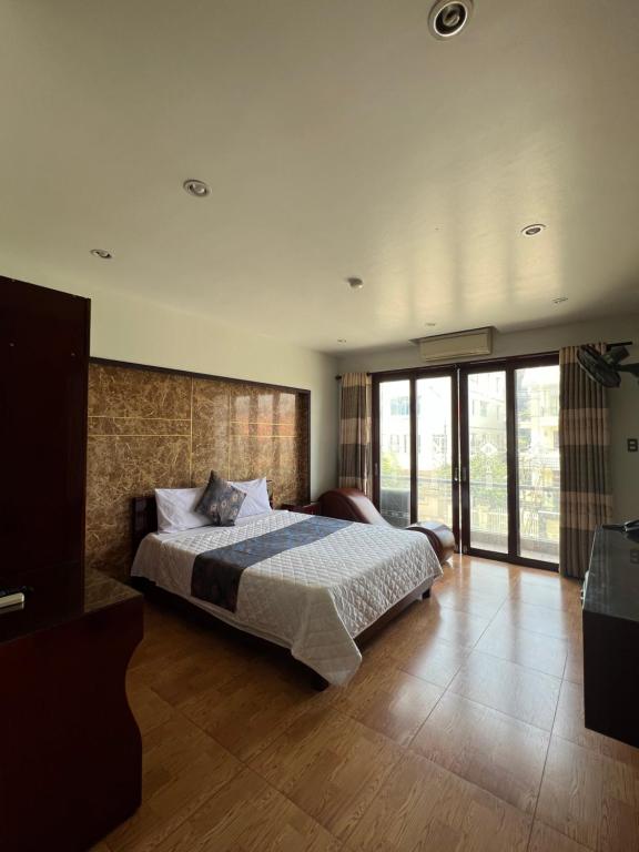 Кровать или кровати в номере Thanh Bình Hotel