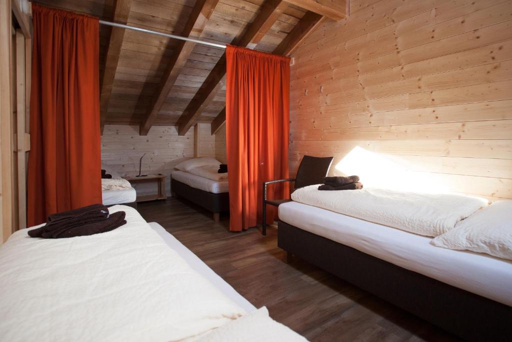 Postel nebo postele na pokoji v ubytování Rutsche Hostel