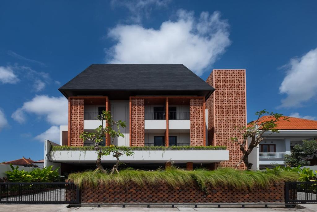 a house with a black roof at Aralea Coliving in Denpasar
