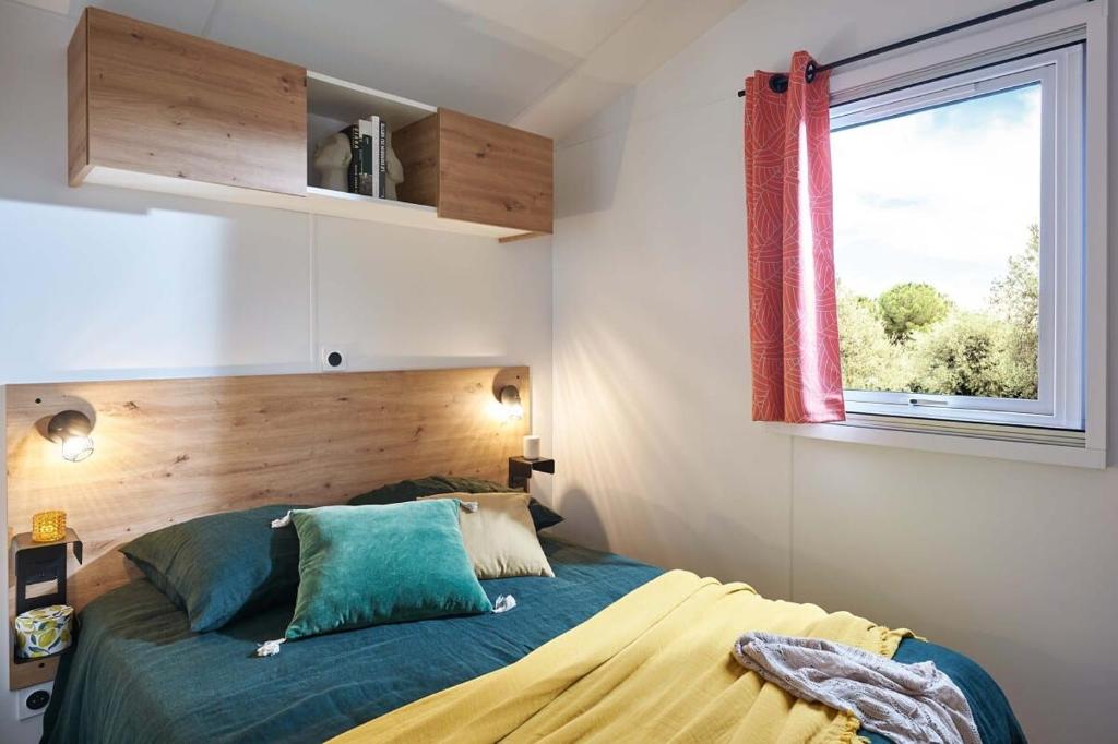 Postel nebo postele na pokoji v ubytování Camping Ty Nénez
