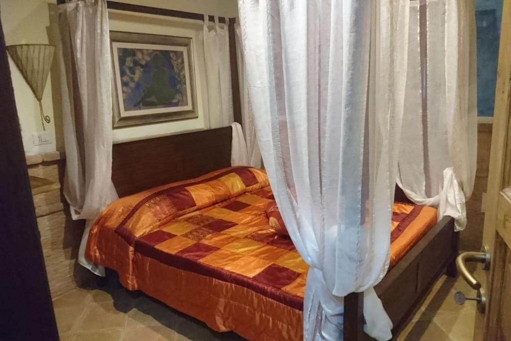 Кровать или кровати в номере Appartamento con veranda 258