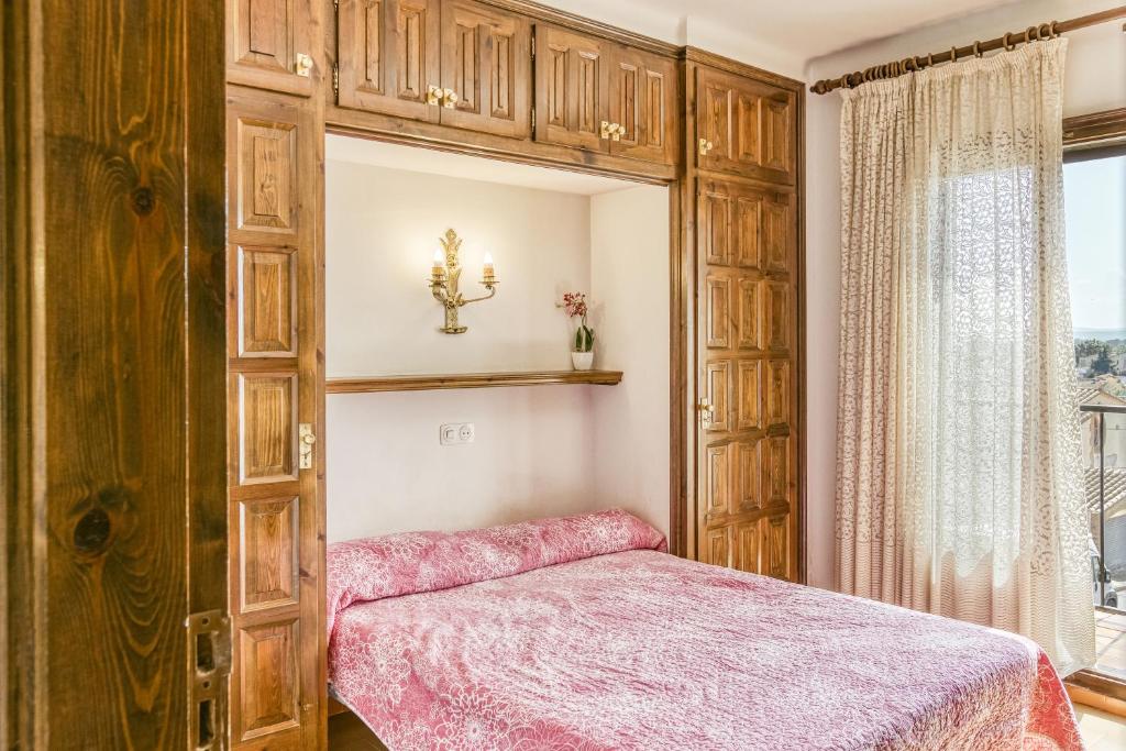 A bed or beds in a room at Casa Saguer