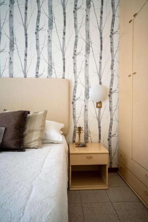 Postel nebo postele na pokoji v ubytování Hotel Maarea